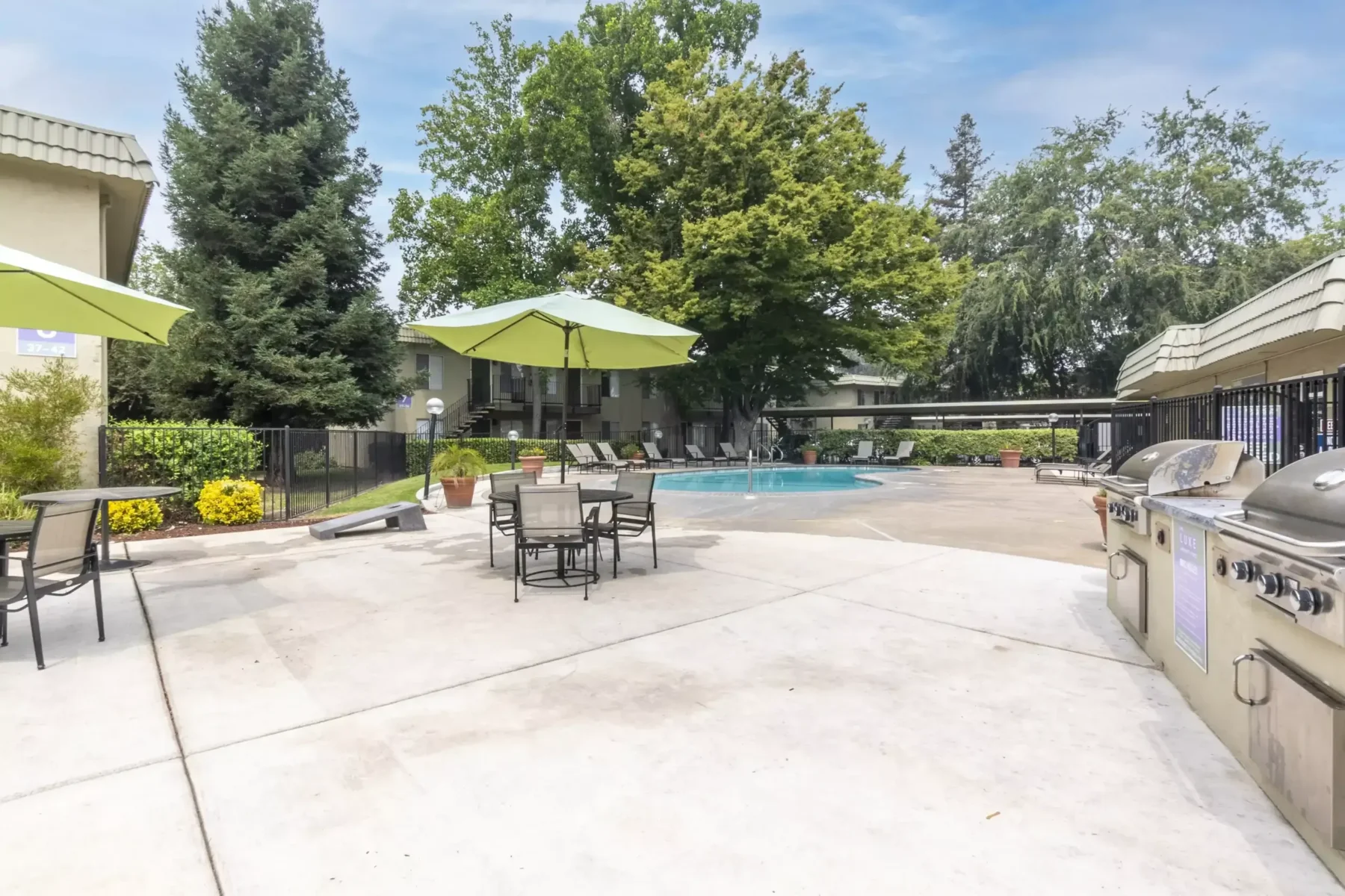 pool and deck with grills